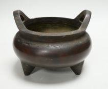 A Chinese bronze censer, ding, 13.5cm tall