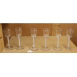 A set of six mid 18th century opaque twist stemmed wine glasses (one a.f.)