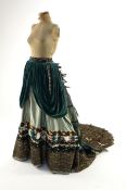 An Edwardian style lady's green taffeta skirt decorated with beaded, sequinned, ribboned border