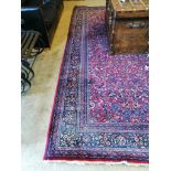 A North West Persian burgundy ground carpet, 364 x 260cm