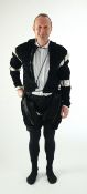 A man's Elizabethan style black smocked velvet and white trim costume, with cod piece and black