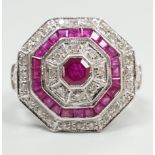 A mid to late 20th century 18ct white gold, ruby and diamond set octagonal cluster target ring, size