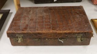 A Finnigans crocodile leather attaché case, pre 1940, with interior figments and blotter, 45cm wide,