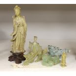 A Chinese soapstone figure, a jadeite figure of a qilin and various bowenite figures etc., tallest
