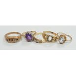 An 18ct, amethyst and diamond set oval cluster ring, size K and four other rings including gem set.