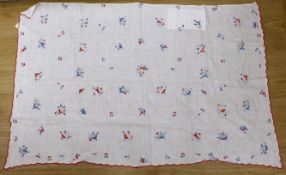 A 20th century woven linen panel, hand embroidered with scattered floral polychrome sprigs and a