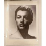 A black and white Photograph of the actor Robert Taylor, signed Hurrell, 20.5cm wide, 25cm high