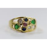 A modern Italian 750 yellow metal and seven stone multi gem collet set ring, size O, gross weight