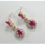 A modern pair of 18k yellow metal, ruby and diamond set pear shaped cluster drop earrings, 20mm,