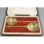 A cased pair of George V silver gilt seal top serving spoons, Manoah Rhodes & Son Ltd, London, 1928,
