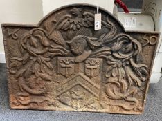 A 17th century style cast iron heraldic fireback width 75cm, height 57cm.