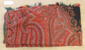 A 19th century Indian red ground paisley shawl with a blue 'fire' central medallion, 320 x 155cm