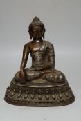 A silver overlaid bronze figure of Buddha Shakyamuni, 26cm