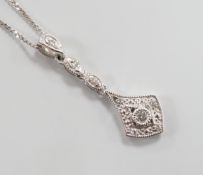 A modern 375 white metal and diamond chip set drop pendant, 23mm, gross 0.6 grams on an 18ct white