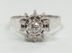 A modern 18ct white metal and diamond cluster set flower head ring, size U, gross weight 5 grams.