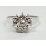 A modern 18ct white metal and diamond cluster set flower head ring, size U, gross weight 5 grams.