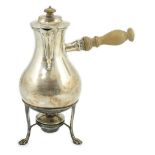 An Edwardian silver baluster chocolate pot, on stand with burner, by Goldsmiths & Silversmiths Co