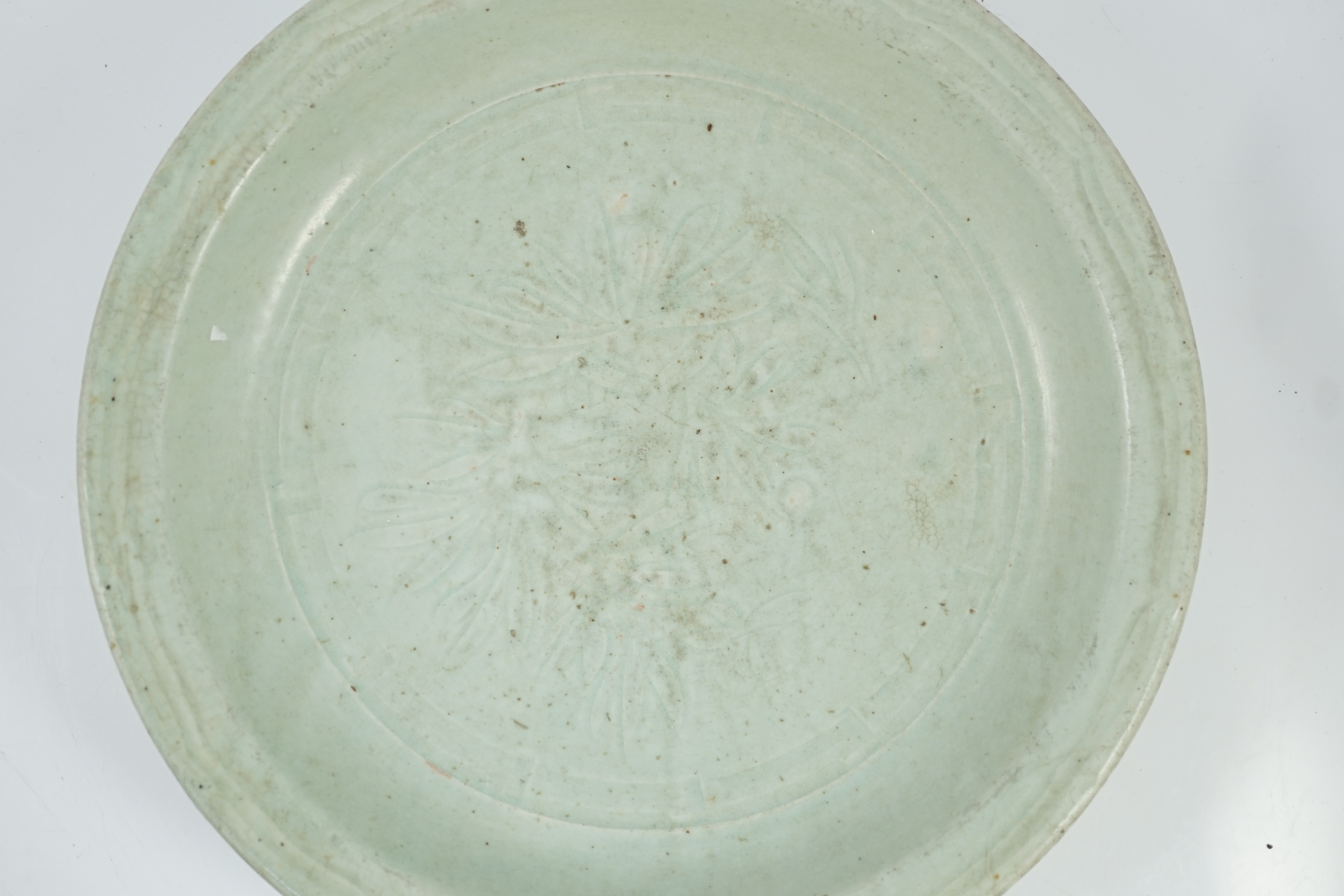 A Chinese Longquan celadon dish, Yuan-Ming dynasty, 13th/14th century, covered in a pale sea green - Image 2 of 10