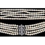 A mid 20th century quintuple strand cultured pearl choker necklace, with diamond cluster set white