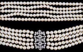 A mid 20th century quintuple strand cultured pearl choker necklace, with diamond cluster set white