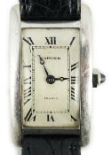 A mid 20th century 18ct white gold Cartier Tank Americane manual wind wrist watch, with