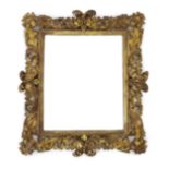 A late 17th/early 18th century Florentine carved giltwood frame, with boldly carved scrolling leaves