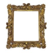 A late 17th/early 18th century Florentine carved giltwood frame, with boldly carved scrolling leaves