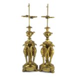 A pair of Empire Revival ormolu table lamps, modelled as urns raised upon eagle monopodia, overall