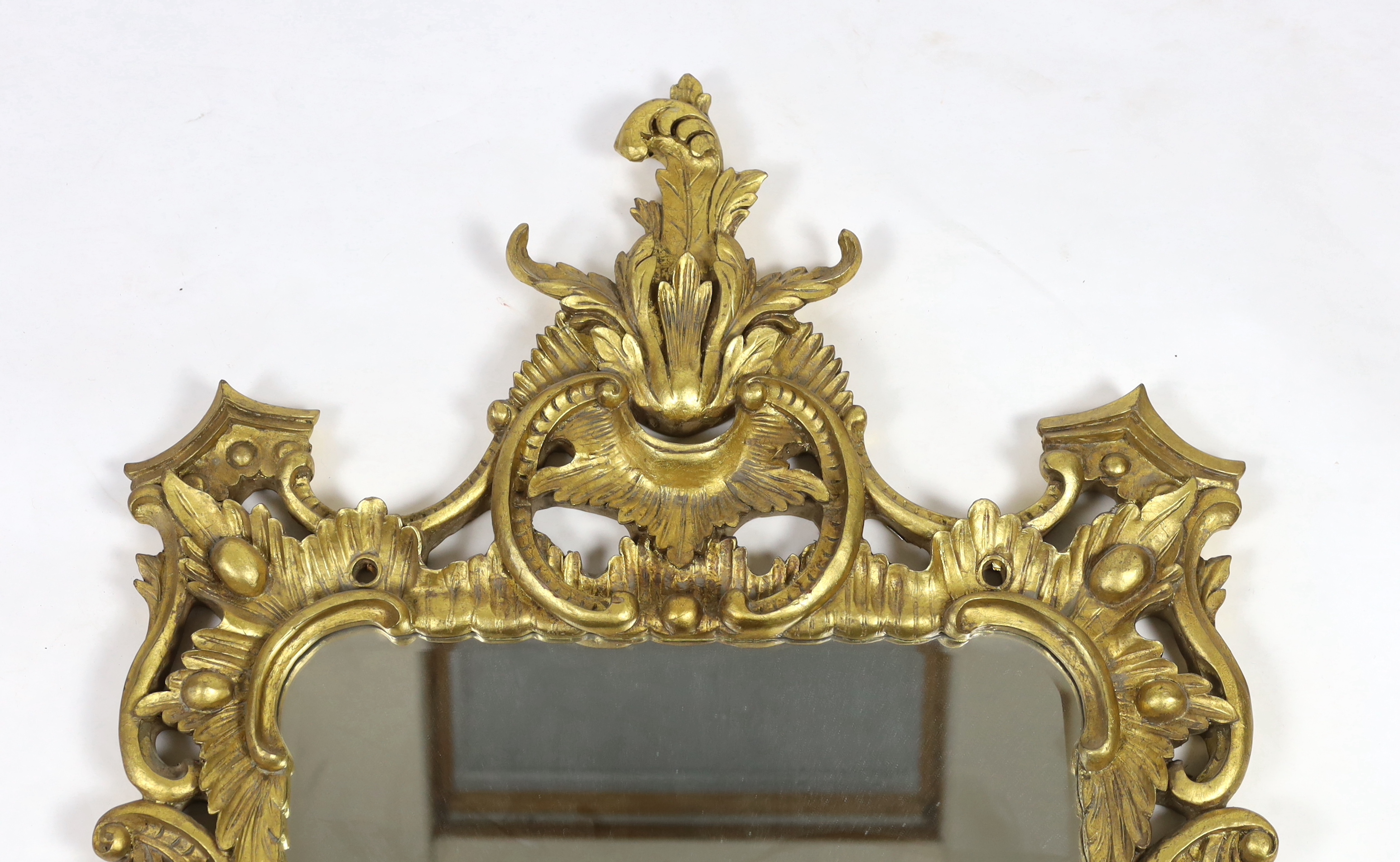 A 19th century Chippendale style carved giltwood wall mirror, with foliate scroll frame and - Image 3 of 4