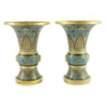 A pair of Chinese cloisonné enamel beaker vases, each decorated with leaf scrolls, ruyi heads, lotus