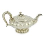 A George IV silver melon shaped pedestal teapot, by Joseph Angell I, with rose finial, on lobed