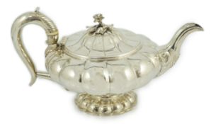 A George IV silver melon shaped pedestal teapot, by Joseph Angell I, with rose finial, on lobed