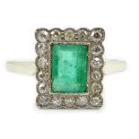 A 1920's 18ct white gold and platinum, emerald and millegrain set diamond rectangular cluster