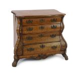 An early 19th century Dutch walnut and marquetry bombé front commode, with serpentine top and four