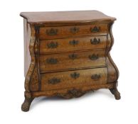 An early 19th century Dutch walnut and marquetry bombé front commode, with serpentine top and four