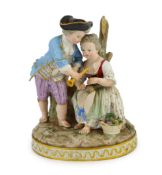 A Meissen group of a boy and a girl with a piccolo, 19th century, the oval base modelled with two