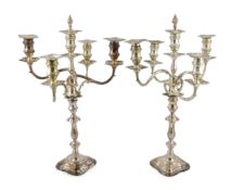 A good pair of George V silver four branch five light candelabra, by Elkington & Co., with waisted