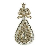 An early 19th century gold and rose cut diamond cluster set pear shaped drop pendant, with ribbon