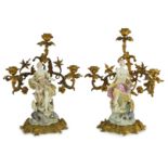 A pair of large Derby porcelain and ormolu mounted ‘Juno and Jupiter’ figural candelabra, the