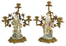 A pair of large Derby porcelain and ormolu mounted ‘Juno and Jupiter’ figural candelabra, the