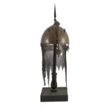 A 19th century Persian Kulah Khud, with spike finial and silvered decoration including an