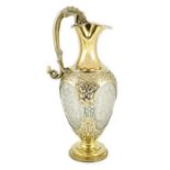 A good Victorian silver gilt mounted etched glass claret jug, by Goldsmiths Alliance, with grotesque