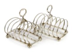 A pair of late Victorian silver seven bar toast racks by John Samuel Hunt (Hunt & Roskell late Storr