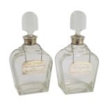 A pair of George VI silver mounted glass decanters and stoppers, by Adie Bros, presented to Mr. J.M.