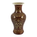 An unusual Chinese gilded flambé baluster vase, 19th century, the streaked ox blood glaze gilt