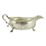 A George II Scottish silver sauce boat by Edward Lothian, with engraved armorial and motto, the