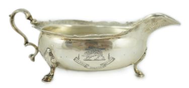 A George II Scottish silver sauce boat by Edward Lothian, with engraved armorial and motto, the