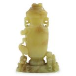 A Chinese yellow and russet jade vase and cover, 19th/20th century, of flattened baluster shape,