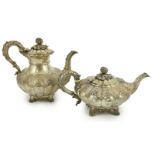 A George IV silver melon shaped coffee pot and matching tea pot by The Barnards, with thistle leaf