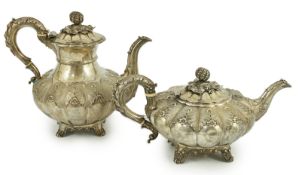 A George IV silver melon shaped coffee pot and matching tea pot by The Barnards, with thistle leaf